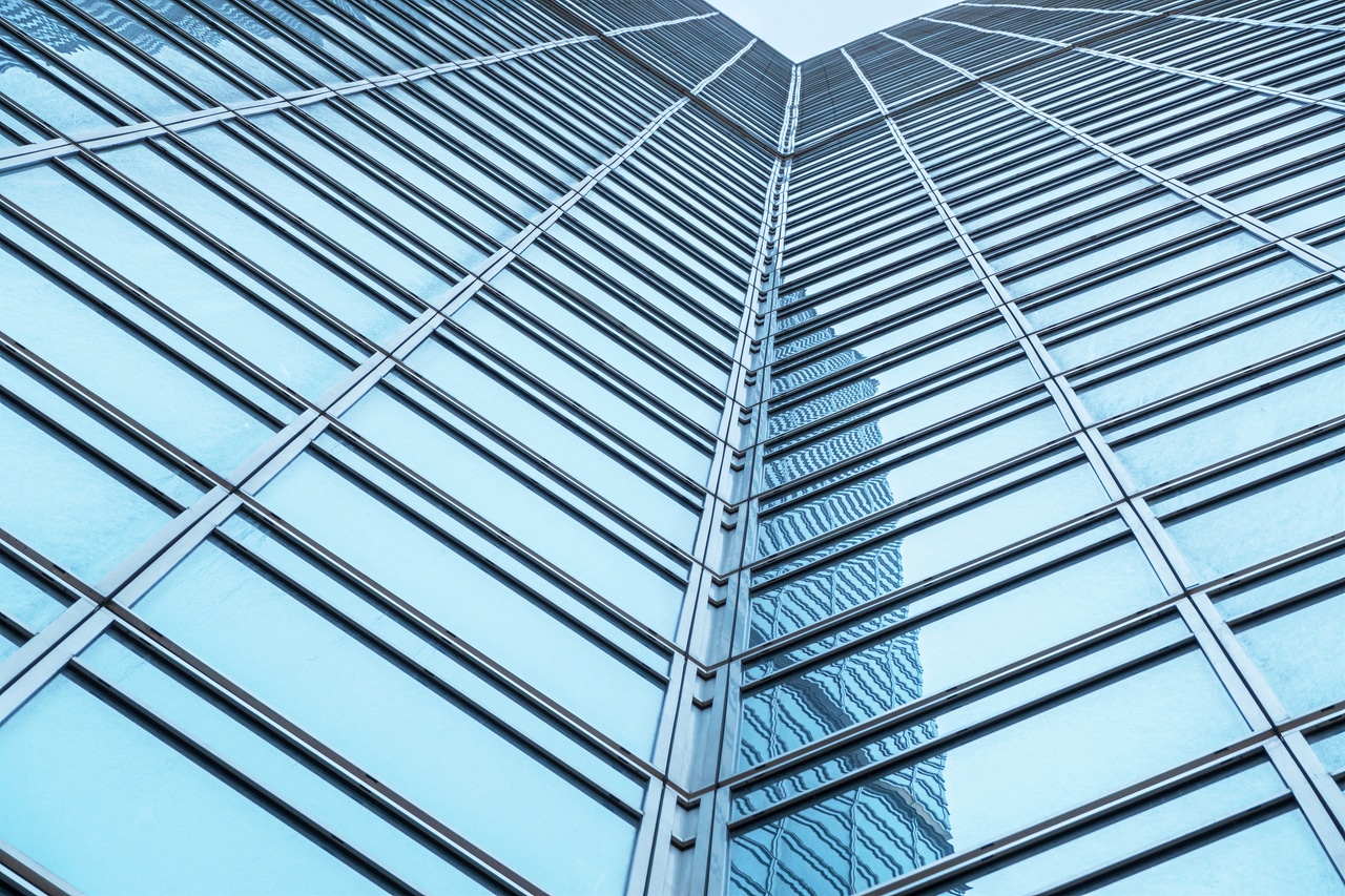 Upward view of glass building facade