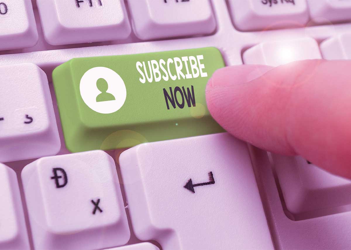 Finger pressing green subscribe key - The Rise of Subscription-Based Exterior Cleaning Services